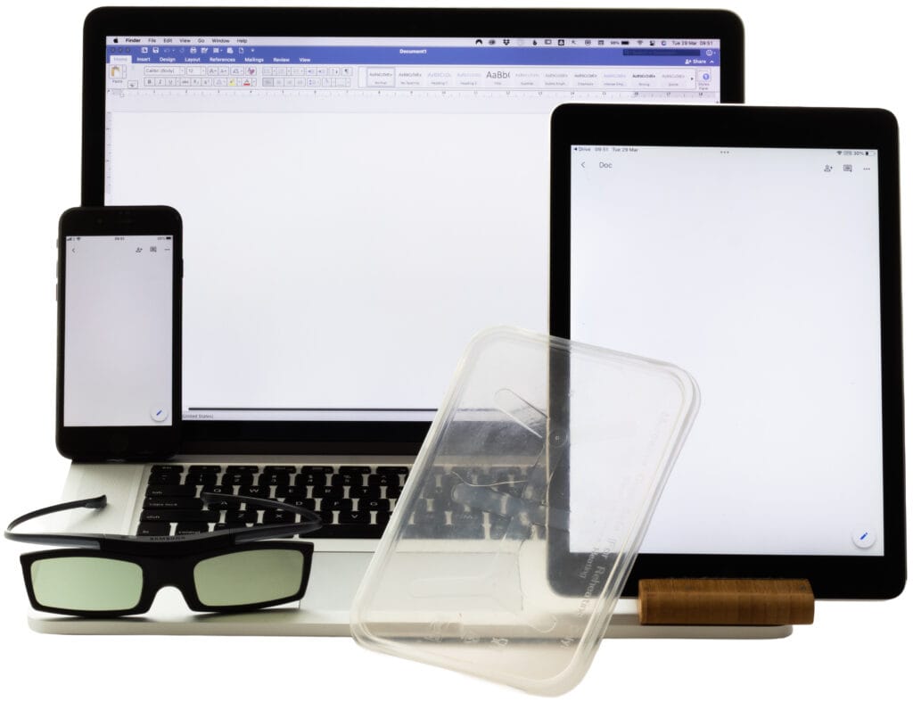 Laptop, mobile phone, tablet, polarising glasses, and a piece of plastic used for photography with polarised light.