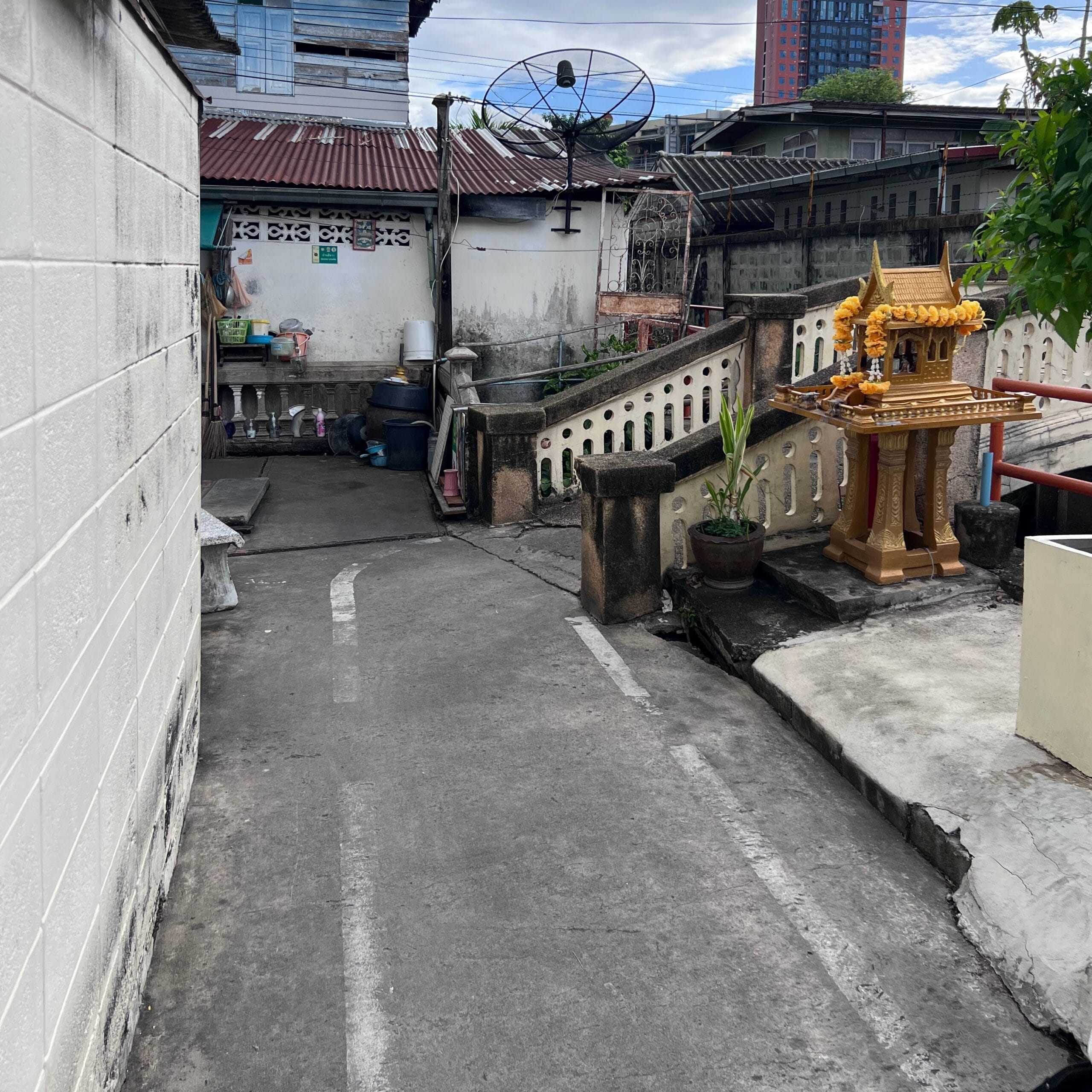 Small concrete footbridge over a Bangkok canal