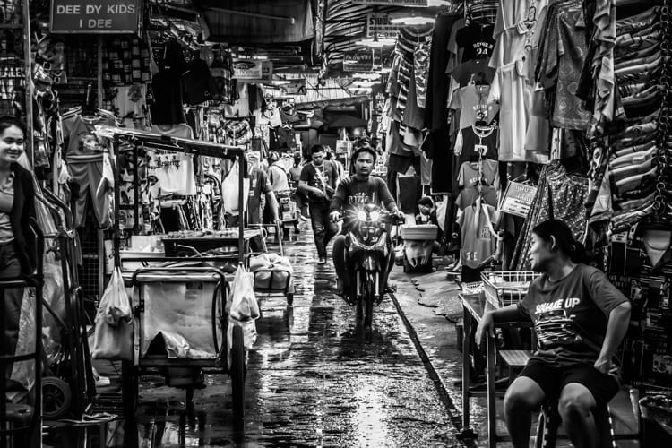 Monochrome image of the Bobae clothing market near Saen Saep Canal, Bangkok, on a wet day