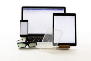 Close up - The items needed for polarised light photography - a laptop, tablet, phone, polaroid sunglasses or 3D glasses and some plastic object.